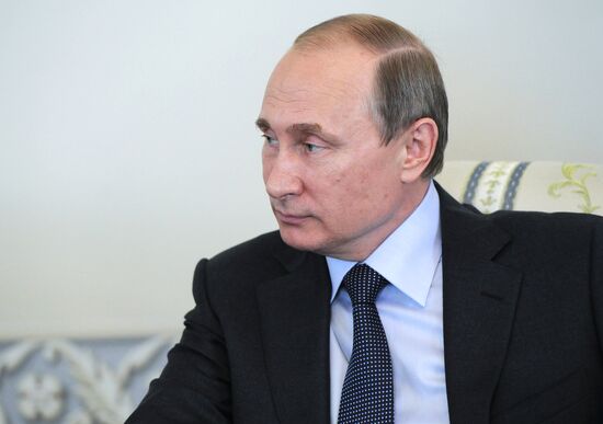 President Vladimir Putin meets with FIFA Presidentt Sepp Blatter