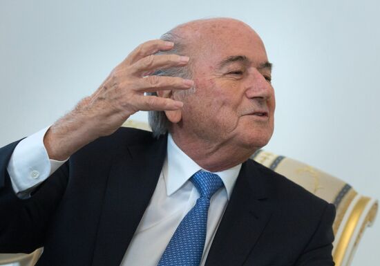 President Vladimir Putin meets with FIFA Presidentt Sepp Blatter