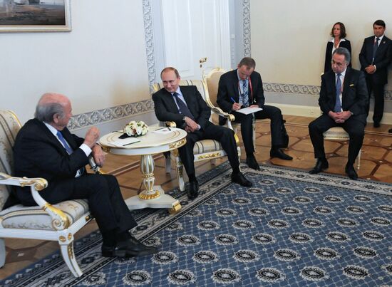 President Vladimir Putin meets with FIFA Presidentt Sepp Blatter