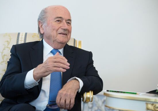 President Vladimir Putin meets with FIFA Presidentt Sepp Blatter