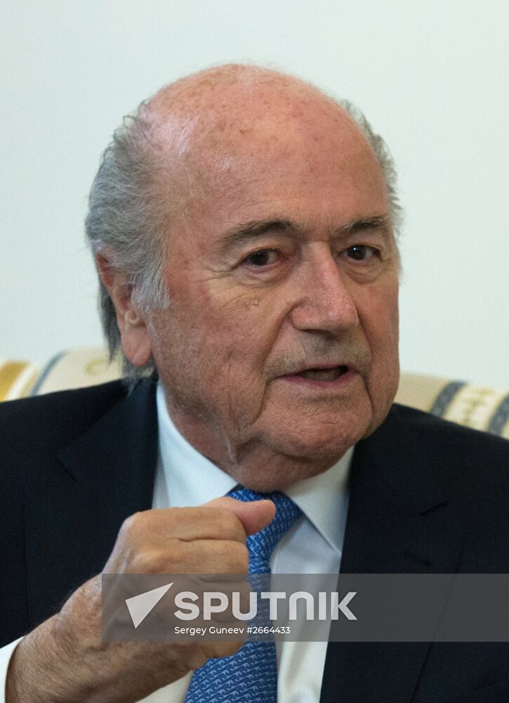 President Vladimir Putin meets with FIFA Presidentt Sepp Blatter