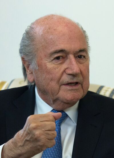 President Vladimir Putin meets with FIFA Presidentt Sepp Blatter