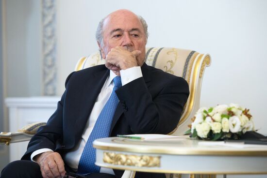 President Vladimir Putin meets with FIFA Presidentt Sepp Blatter