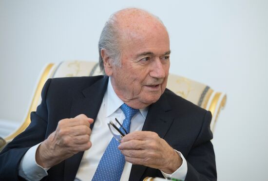 President Vladimir Putin meets with FIFA Presidentt Sepp Blatter