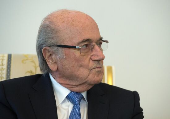 President Vladimir Putin meets with FIFA Presidentt Sepp Blatter