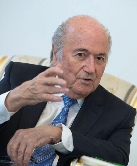 President Vladimir Putin meets with FIFA Presidentt Sepp Blatter