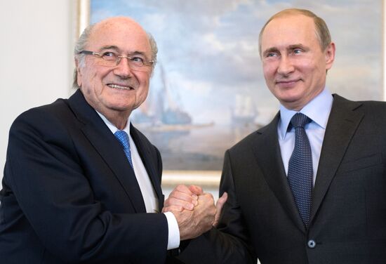 President Vladimir Putin meets with FIFA Presidentt Sepp Blatter