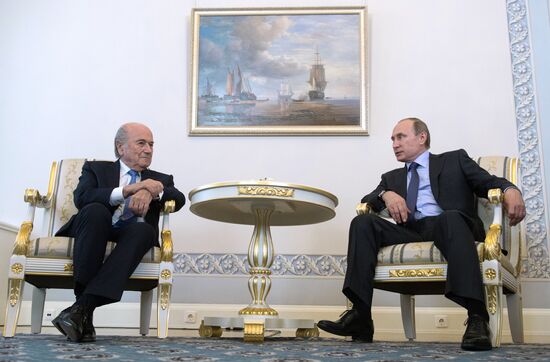 President Vladimir Putin meets with FIFA Presidentt Sepp Blatter