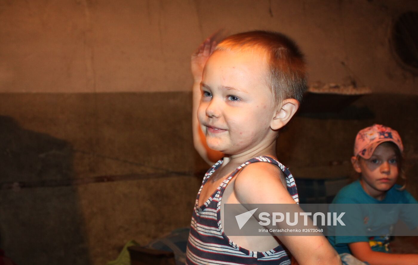 Children at bombproof shelter in Donetsk