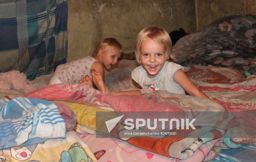 Children at bombproof shelter in Donetsk