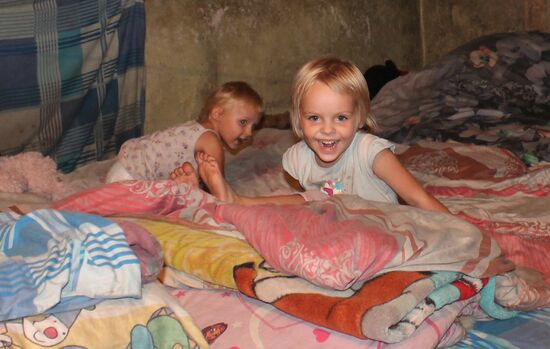 Children at bombproof shelter in Donetsk