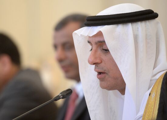 Saudi Arabian Foreign Minister Adel bin Ahmed Al-Jubeir, center, meets with Russian Foreign Minister Sergey Lavrov in Moscow.
