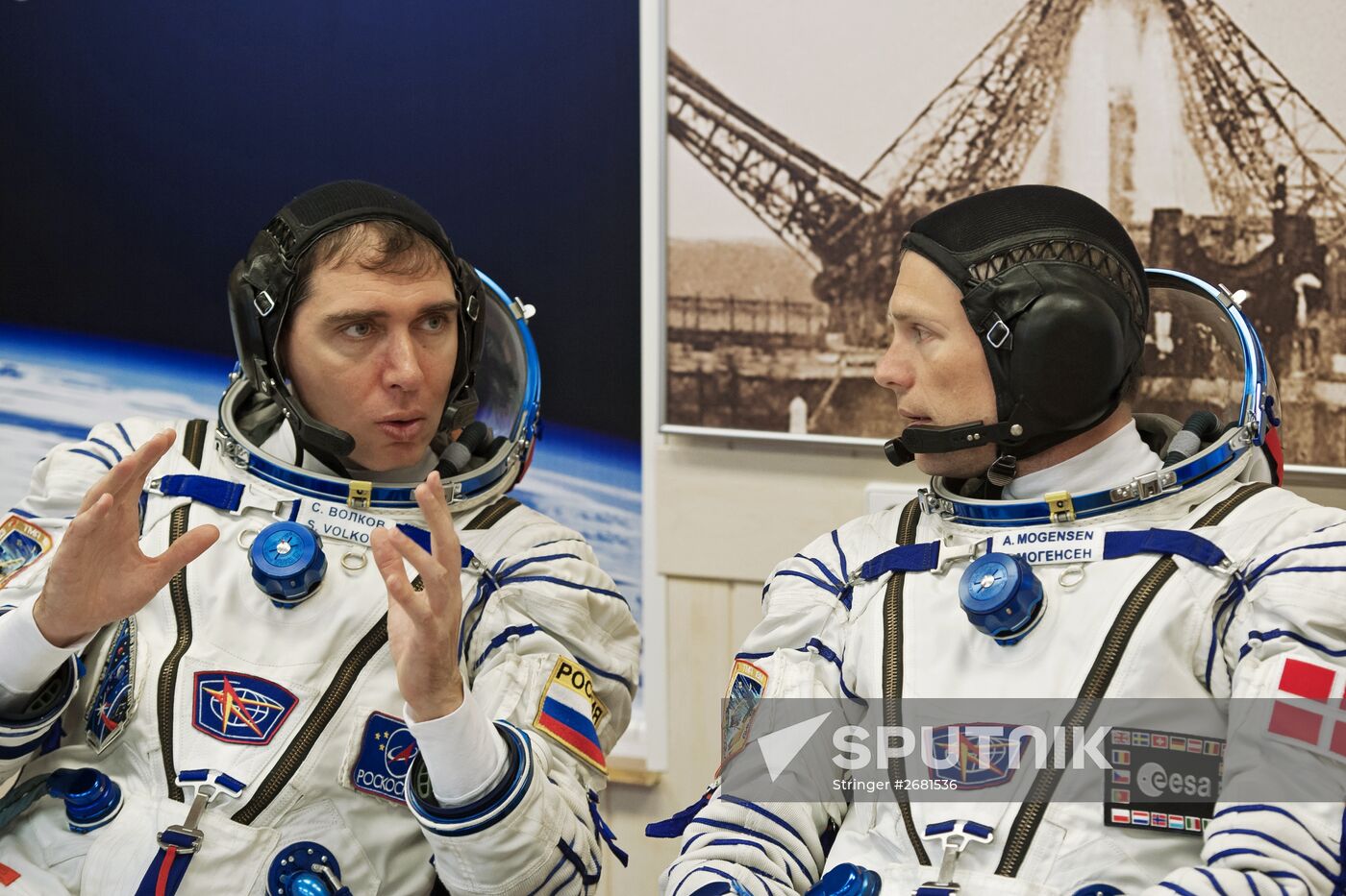 ISS-45/46 and Visiting Expedition 18 primary crew try on space suits and inspect space ship