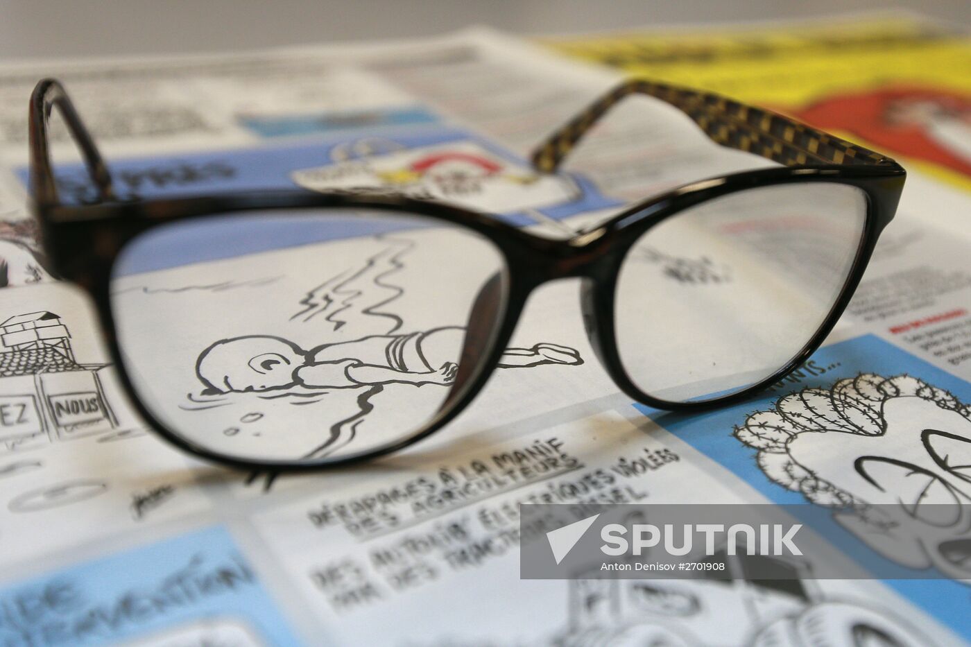 Charlie Hebdo published cartoons mocking drowned Syrian boy