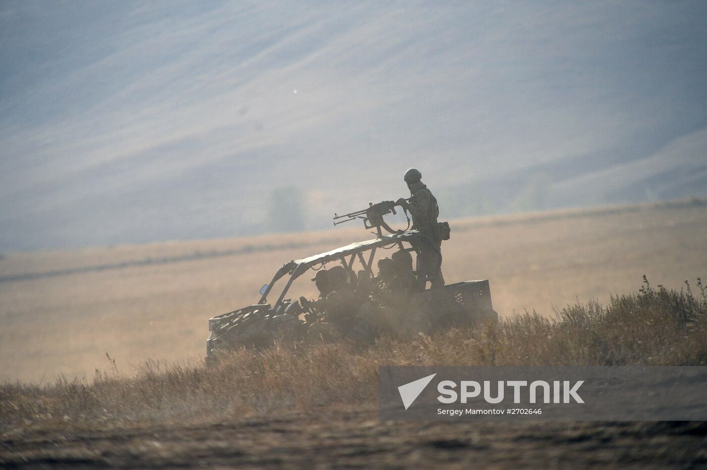 Russian Defense Minister Shoigu arrives at Donguz base for Tsentr-2015 drill