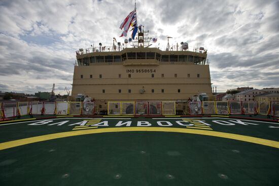 Hoisting the Russian state flag aboard the icebreaker Vladivostok