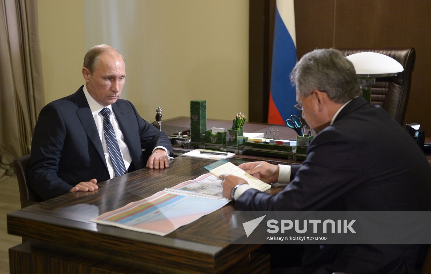 President Vladimir Putin meets with Defense Minister Sergei Shoigu