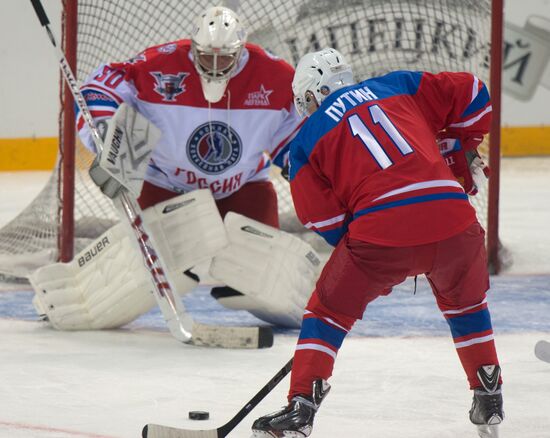 Vladimir Putin takes part in hockey match between Night Hockey League champions and board members and honorary guests