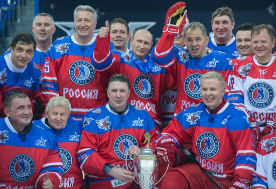 Vladimir Putin takes part in hockey match between Night Hockey League champions and board members and honorary guests