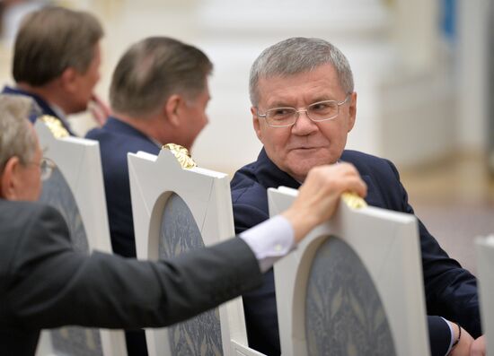 Russian President Vladimir Putin presents banner of Federal Bailiff Service