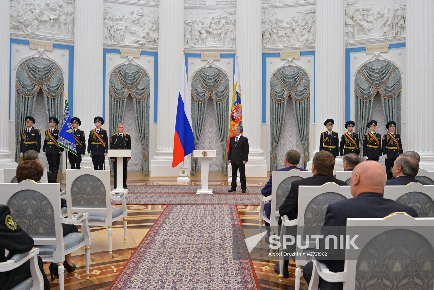 Russian President Vladimir Putin presents banner of Federal Bailiff Service