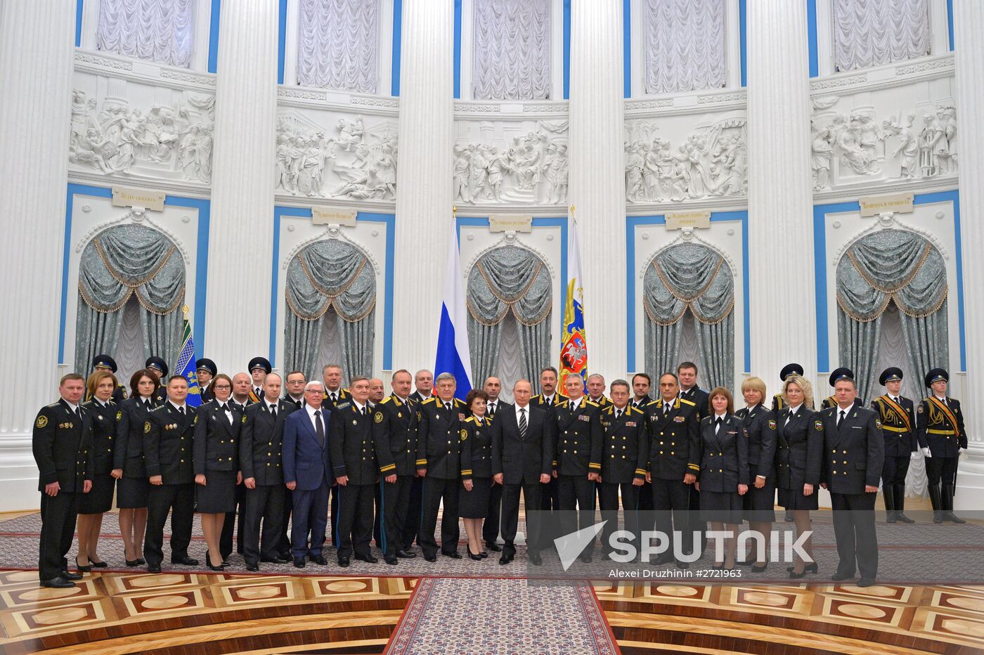 Russian President Vladimir Putin presents banner of Federal Bailiff Service