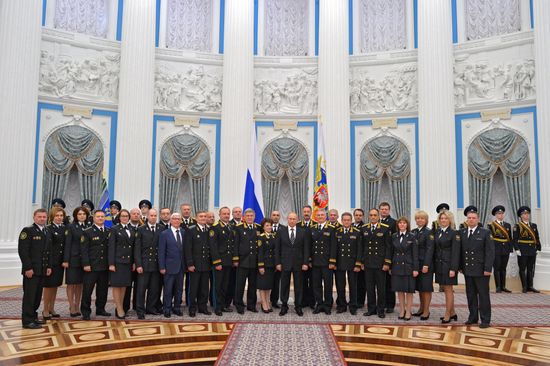 Russian President Vladimir Putin presents banner of Federal Bailiff Service