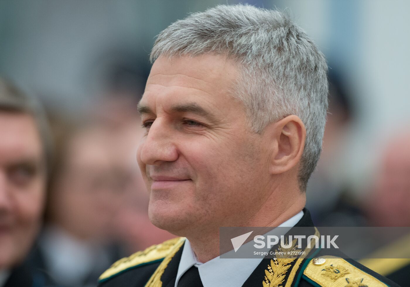 Russian President Vladimir Putin presents banner of Federal Bailiff Service