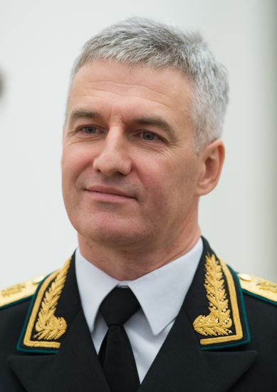 Russian President Vladimir Putin presents banner of Federal Bailiff Service