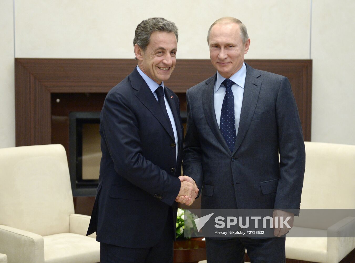 Russian President Vladimir Putin meets with France's former President Nicolas Sarkozy