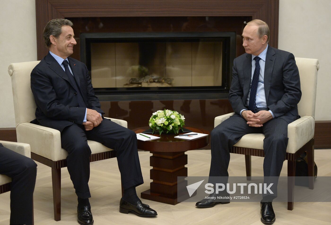 Russian President Vladimir Putin meets with France's former President Nicolas Sarkozy