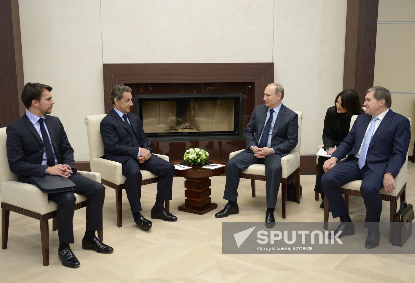 Russian President Vladimir Putin meets with France's former President Nicolas Sarkozy