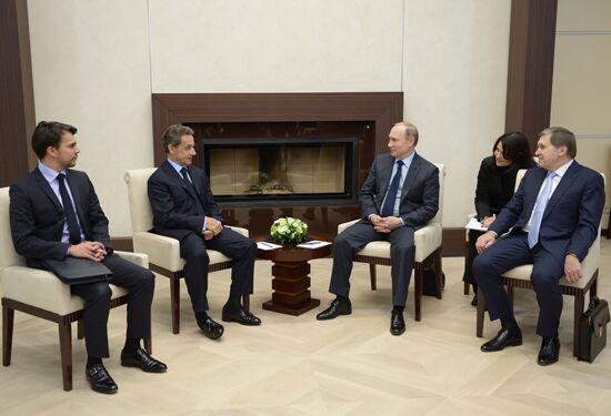 Russian President Vladimir Putin meets with France's former President Nicolas Sarkozy