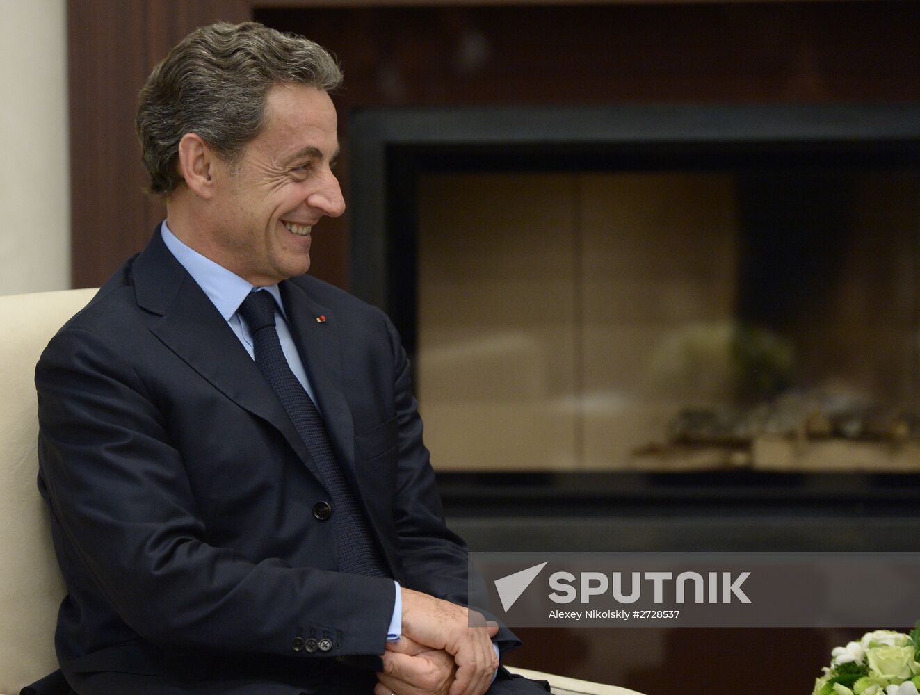 Russian President Vladimir Putin meets with France's former President Nicolas Sarkozy