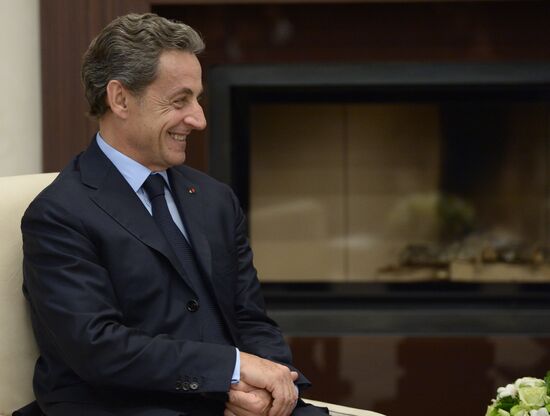Russian President Vladimir Putin meets with France's former President Nicolas Sarkozy