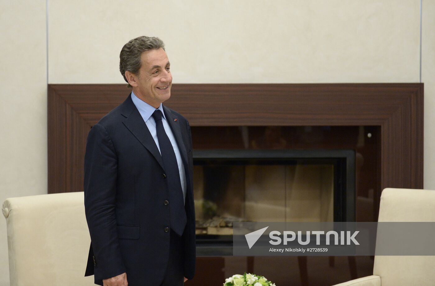 Russian President Vladimir Putin meets with France's former President Nicolas Sarkozy