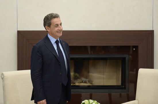 Russian President Vladimir Putin meets with France's former President Nicolas Sarkozy