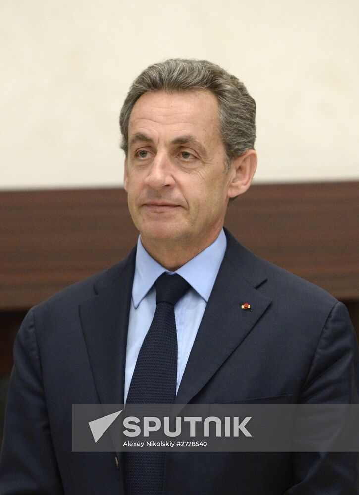 Russian President Vladimir Putin meets with France's former President Nicolas Sarkozy