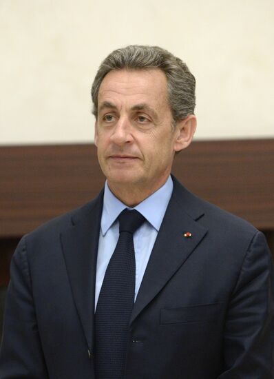 Russian President Vladimir Putin meets with France's former President Nicolas Sarkozy