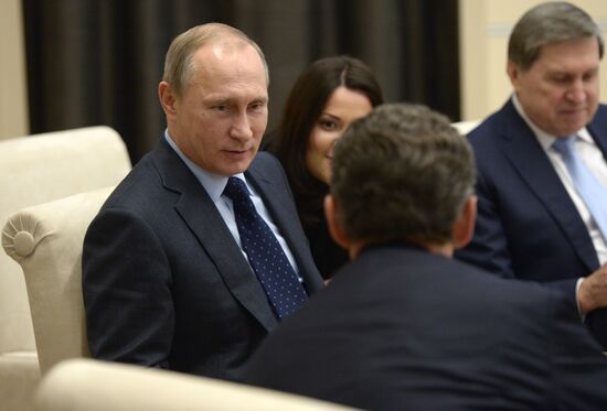 President Vladimir Putin meets with France's former President Nicolas Sarkozy