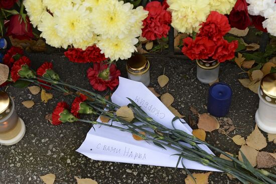 Flowers in memory of Airbus A321 crash victims near Russian embassies in foreign countries