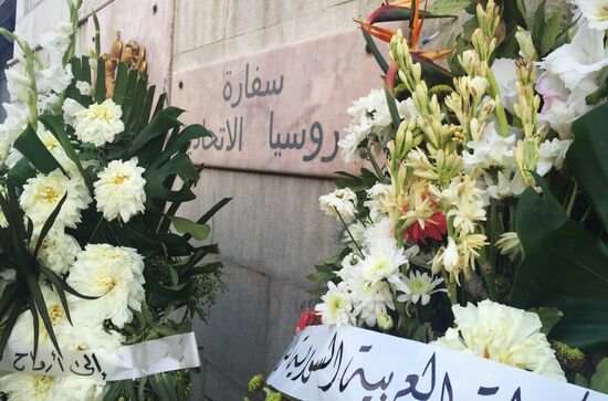 Flowers in memory of Airbus A321 crash victims near Russian embassies in foreign countries