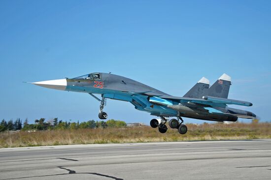 Russian warplanes at Hemeimeem air base in Syria