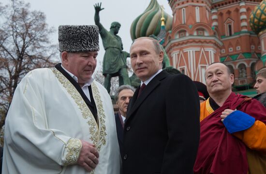 President Putin lays flowers at Minin and Pozharsky monument on Red Square