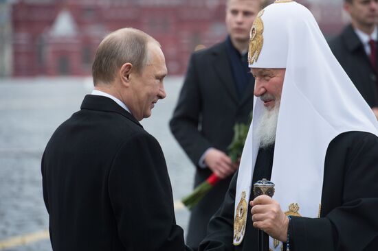 President Putin lays flowers at Minin and Pozharsky monument on Red Square