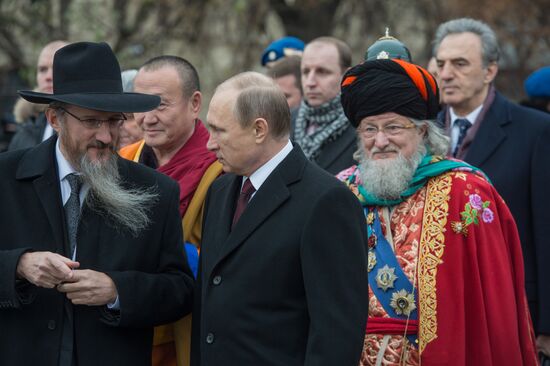 President Putin lays flowers at Minin and Pozharsky monument on Red Square