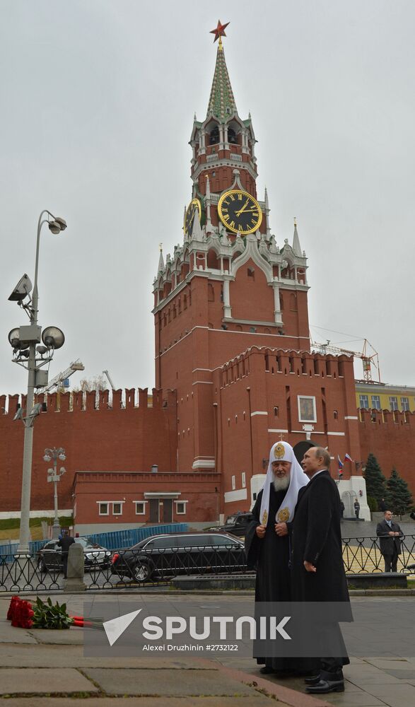 President Putin lays flowers at Minin and Pozharsky monument on Red Square