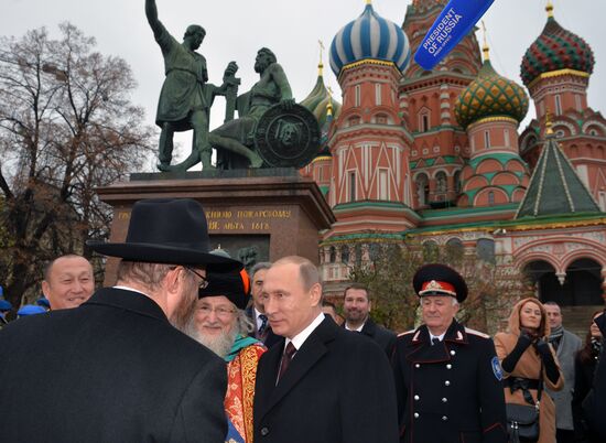 President Putin lays flowers at Minin and Pozharsky monument on Red Square