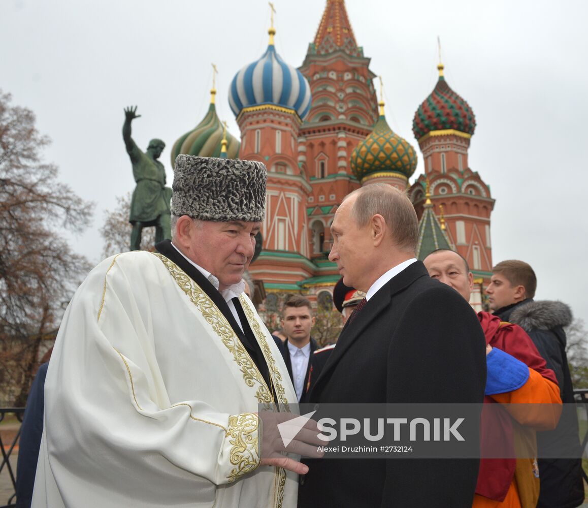 President Putin lays flowers at Minin and Pozharsky monument on Red Square