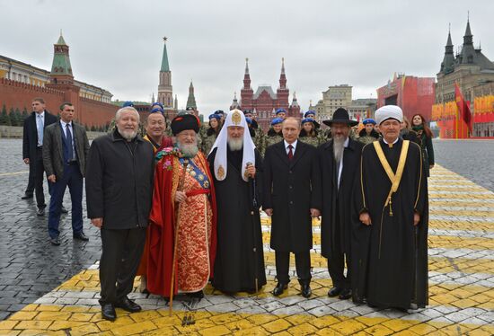 President Putin lays flowers at Minin and Pozharsky monument on Red Square